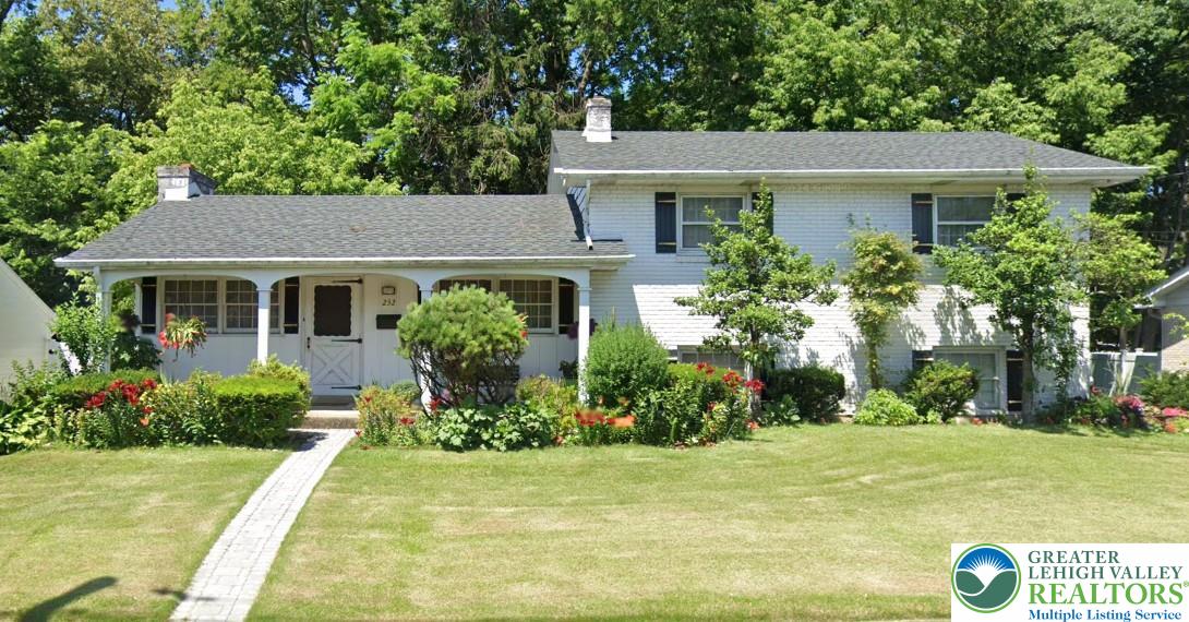 232 Virginia Avenue Whitehall, PA 18052 - Photo 26 of 26 a front view of a house with garden