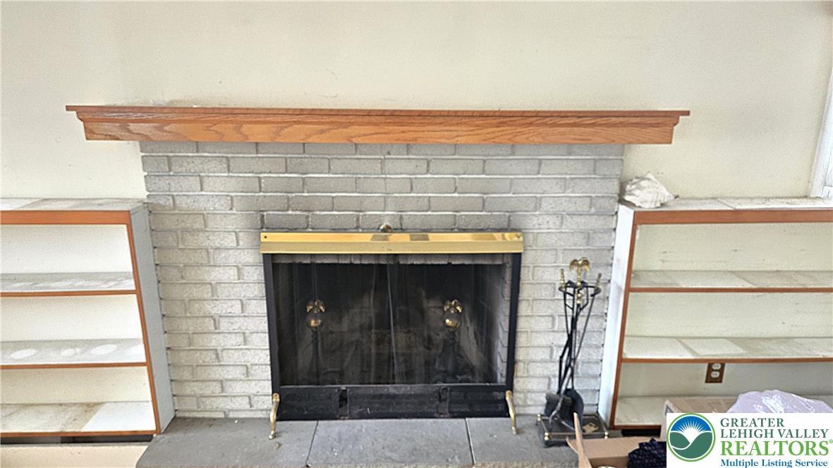 232 Virginia Avenue Whitehall, PA 18052 - Photo 5 of 26 a view of fireplace and window