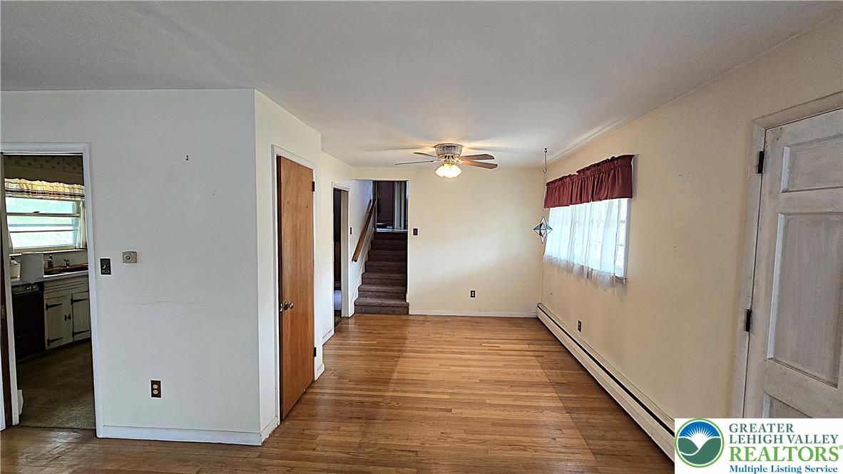 232 Virginia Avenue Whitehall, PA 18052 - Photo 6 of 26 a view of a hallway with wooden floor and staircase