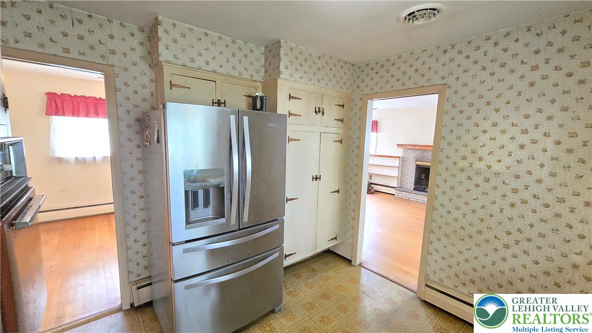232 Virginia Avenue Whitehall, PA 18052 - Photo 9 of 26 a kitchen with stainless steel appliances a refrigerator and a stove