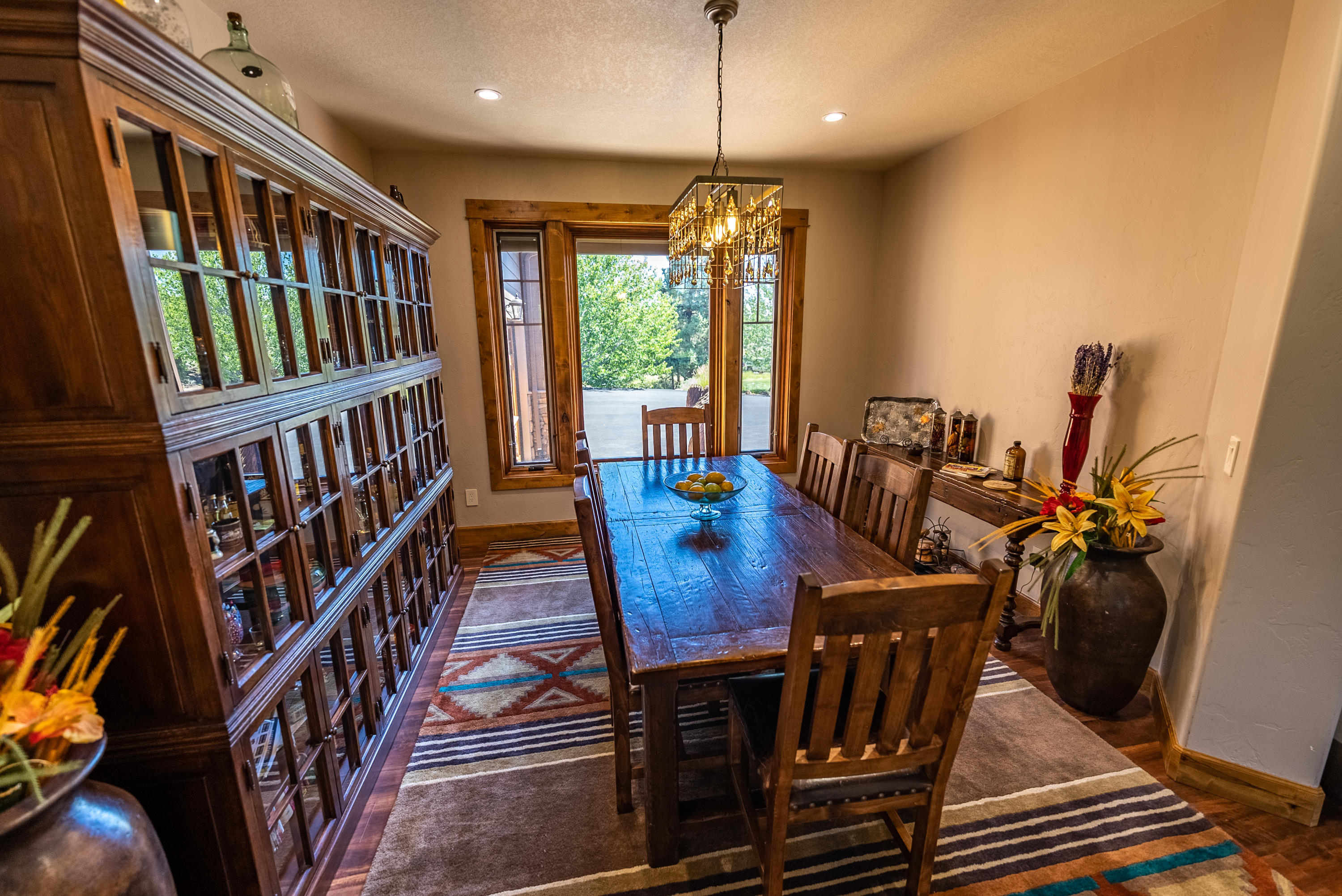 63545 Overtree Road Bend, OR 97701 - Photo 7 of 63 Formal dining room, the chandelier stays, cabinets are not built in here.