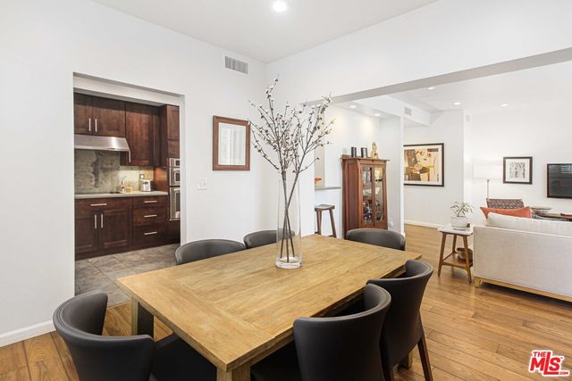 a kitchen with a table and chairs in it