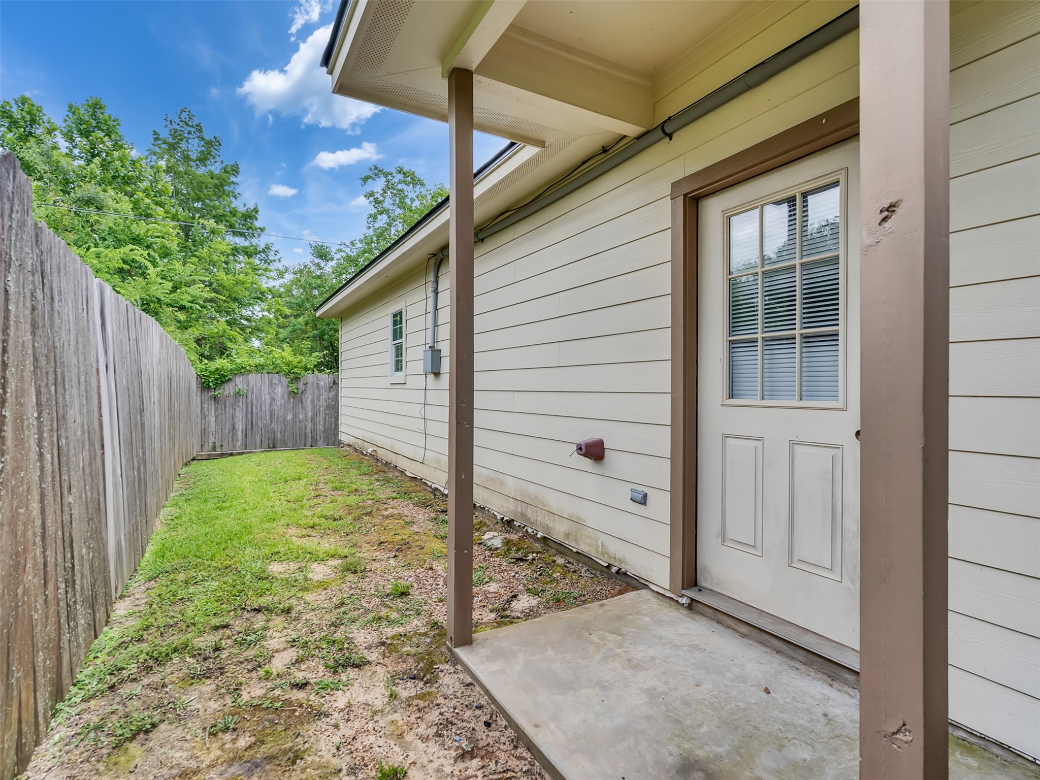 104 Longstreet Road, Unit 2 Willis, TX 77378 - Photo 24 of 26 a view of a backyard