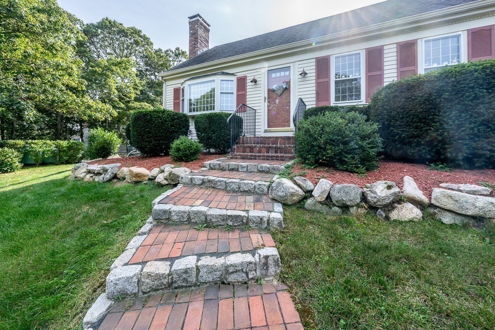 102 Wildwood Road Brewster, MA 02631 - Photo 11 of 41 a front view of house with yard and green space
