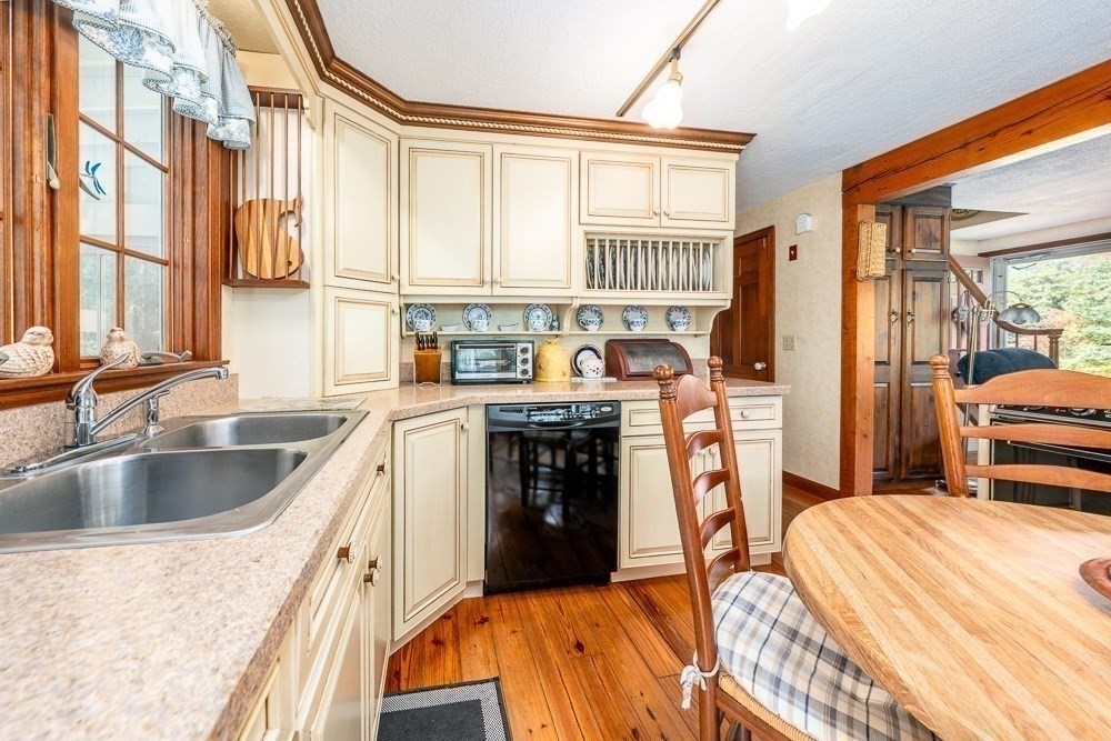 102 Wildwood Road Brewster, MA 02631 - Photo 17 of 41 a kitchen view with granite countertop a sink and a refrigerator