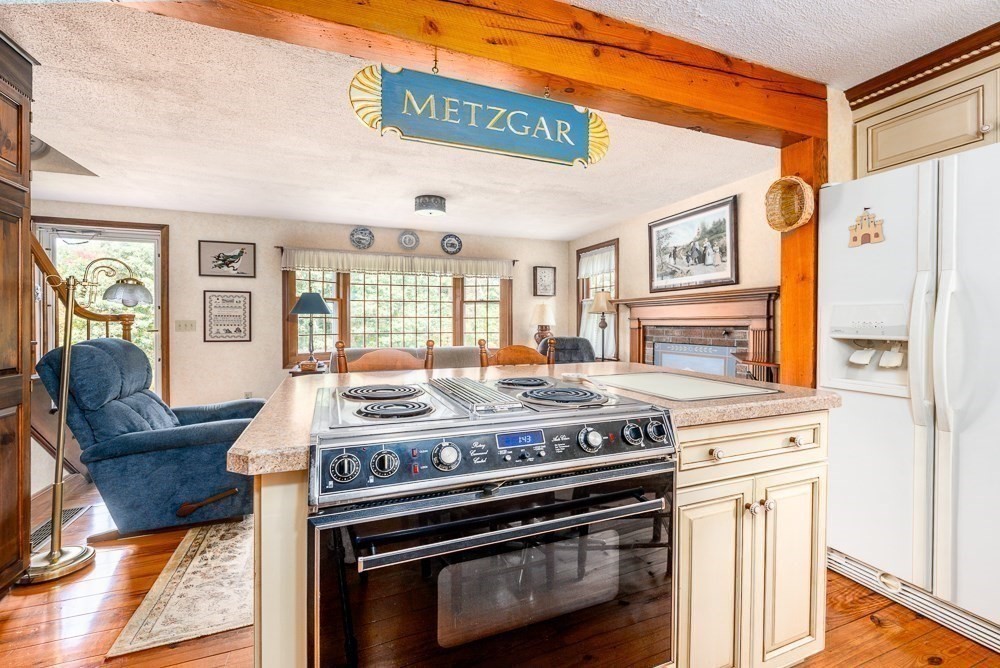 102 Wildwood Road Brewster, MA 02631 - Photo 19 of 41 a view of a kitchen with stainless steel appliances granite countertop a stove and a refrigerator