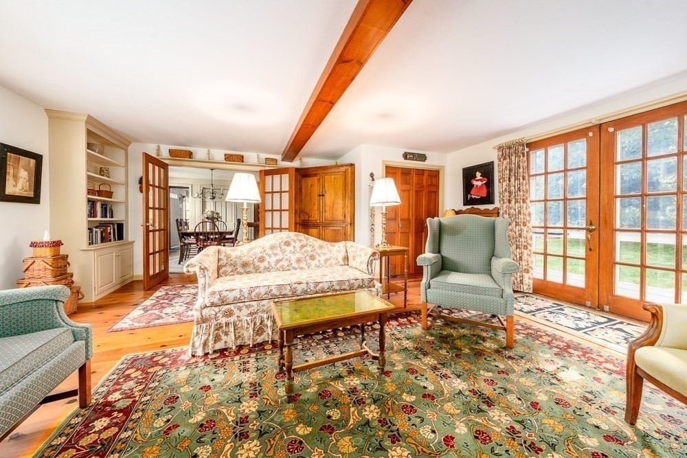 102 Wildwood Road Brewster, MA 02631 - Photo 26 of 41 a living room with furniture and a table