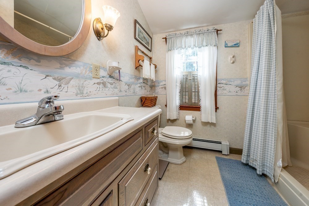 102 Wildwood Road Brewster, MA 02631 - Photo 30 of 41 a bathroom with a sink a toilet and shower