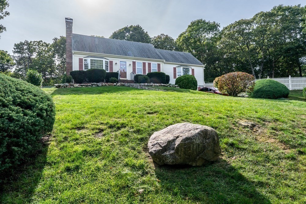 102 Wildwood Road Brewster, MA 02631 - Photo 3 of 41 a view of yard with green space and porch