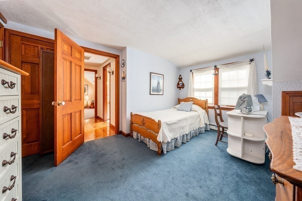 102 Wildwood Road Brewster, MA 02631 - Photo 31 of 41 a spacious bedroom with a bed and a cabinets