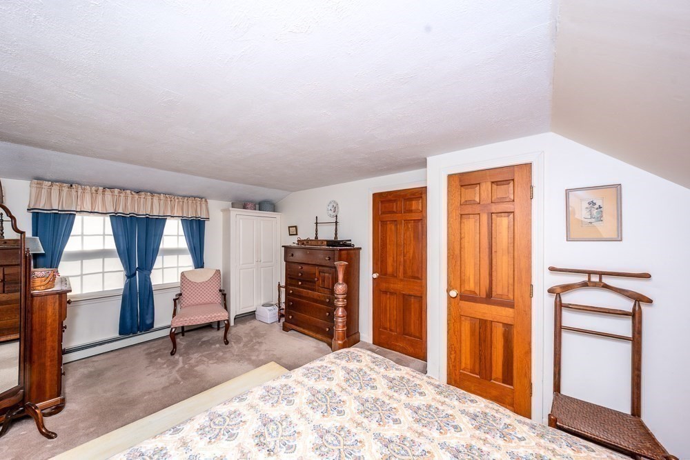 102 Wildwood Road Brewster, MA 02631 - Photo 32 of 41 a view of a bedroom with furniture and window