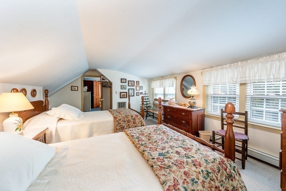 102 Wildwood Road Brewster, MA 02631 - Photo 35 of 41 a bedroom with a large bed and a dresser