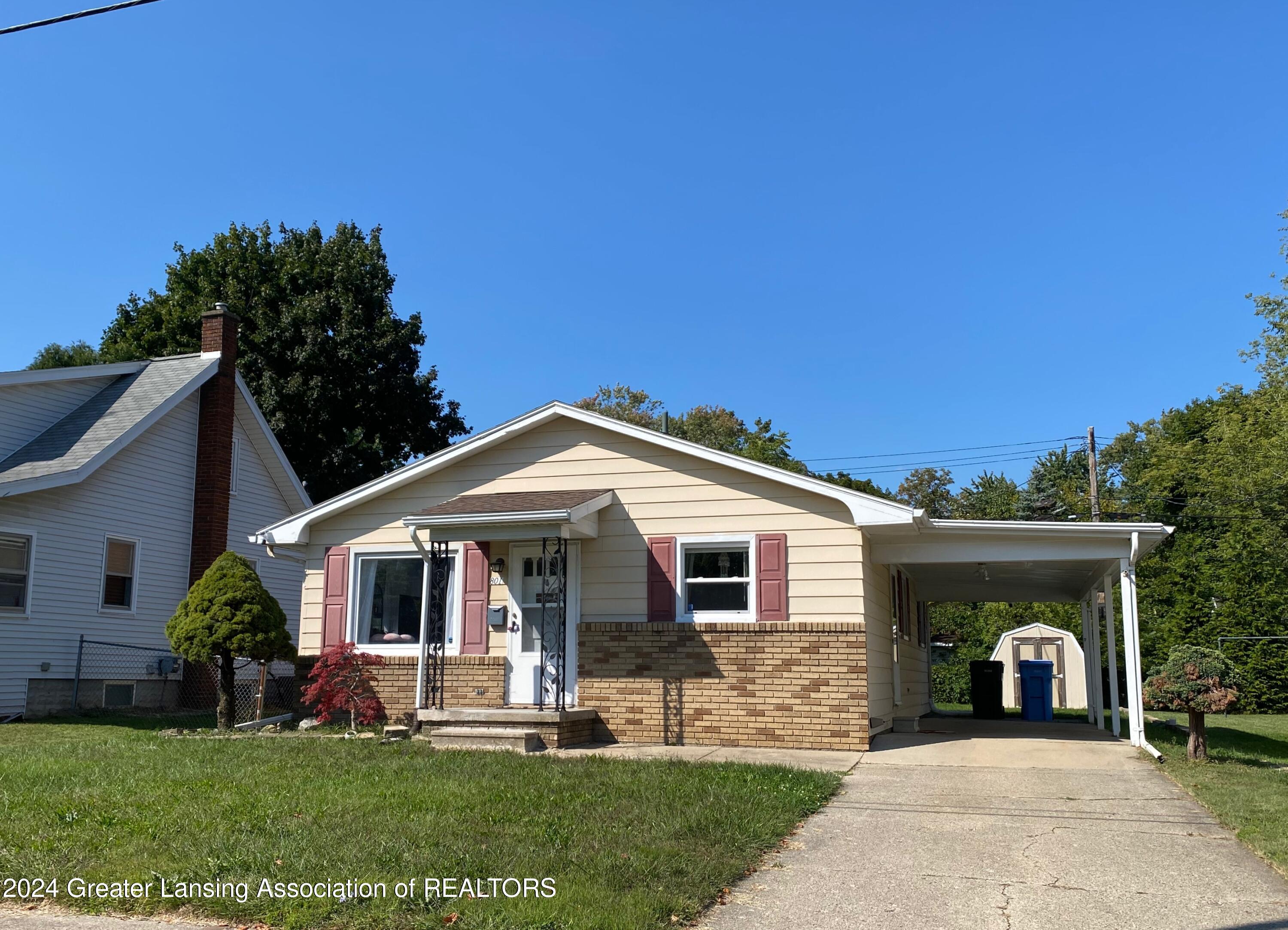 801 East Cavanaugh Road Lansing, MI 48910 - Photo 1 of 27 1 front