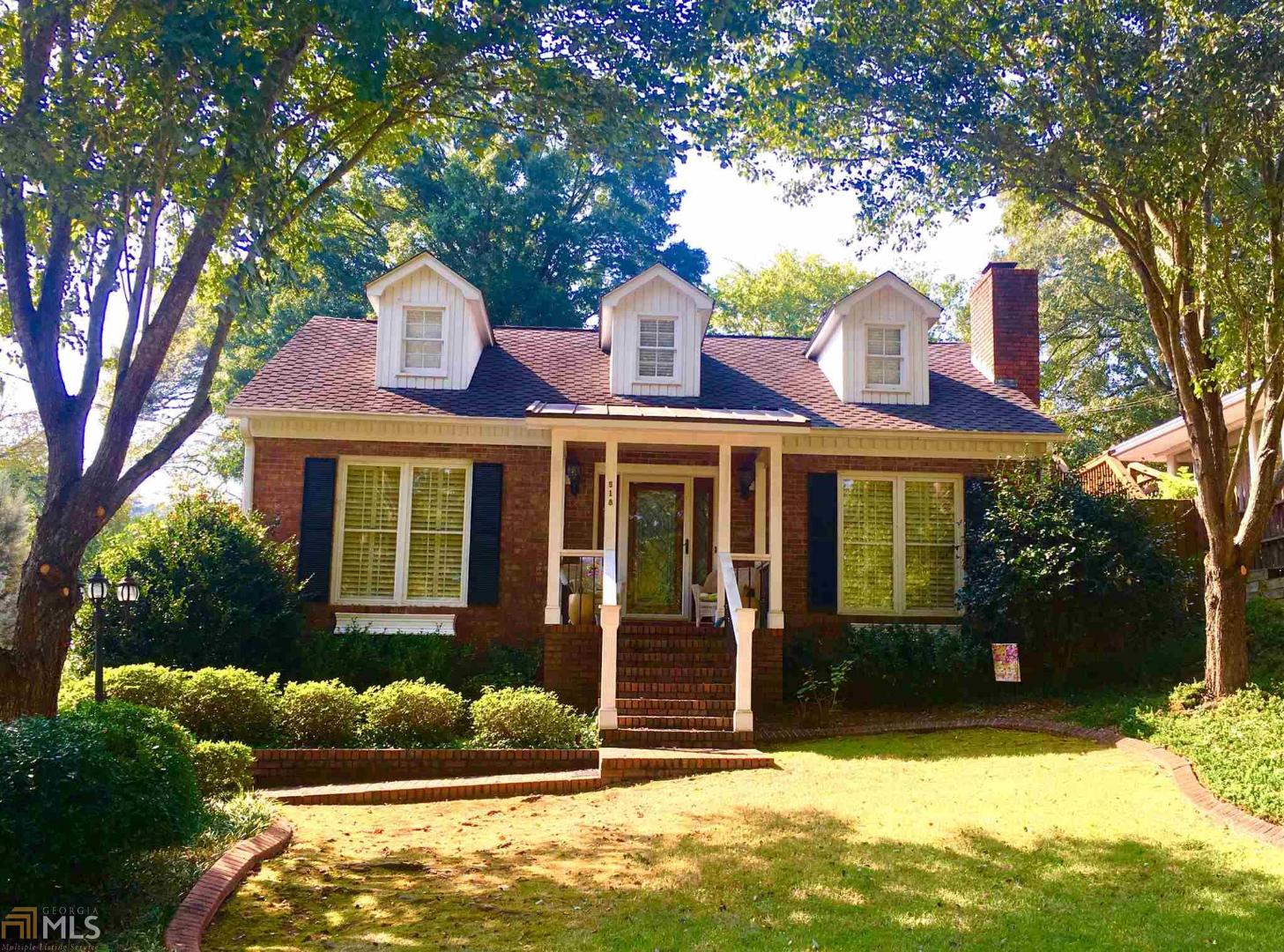 518 East 8th Street Southeast Rome, GA 30161 - Photo 1 of 1 a front view of a house with a yard