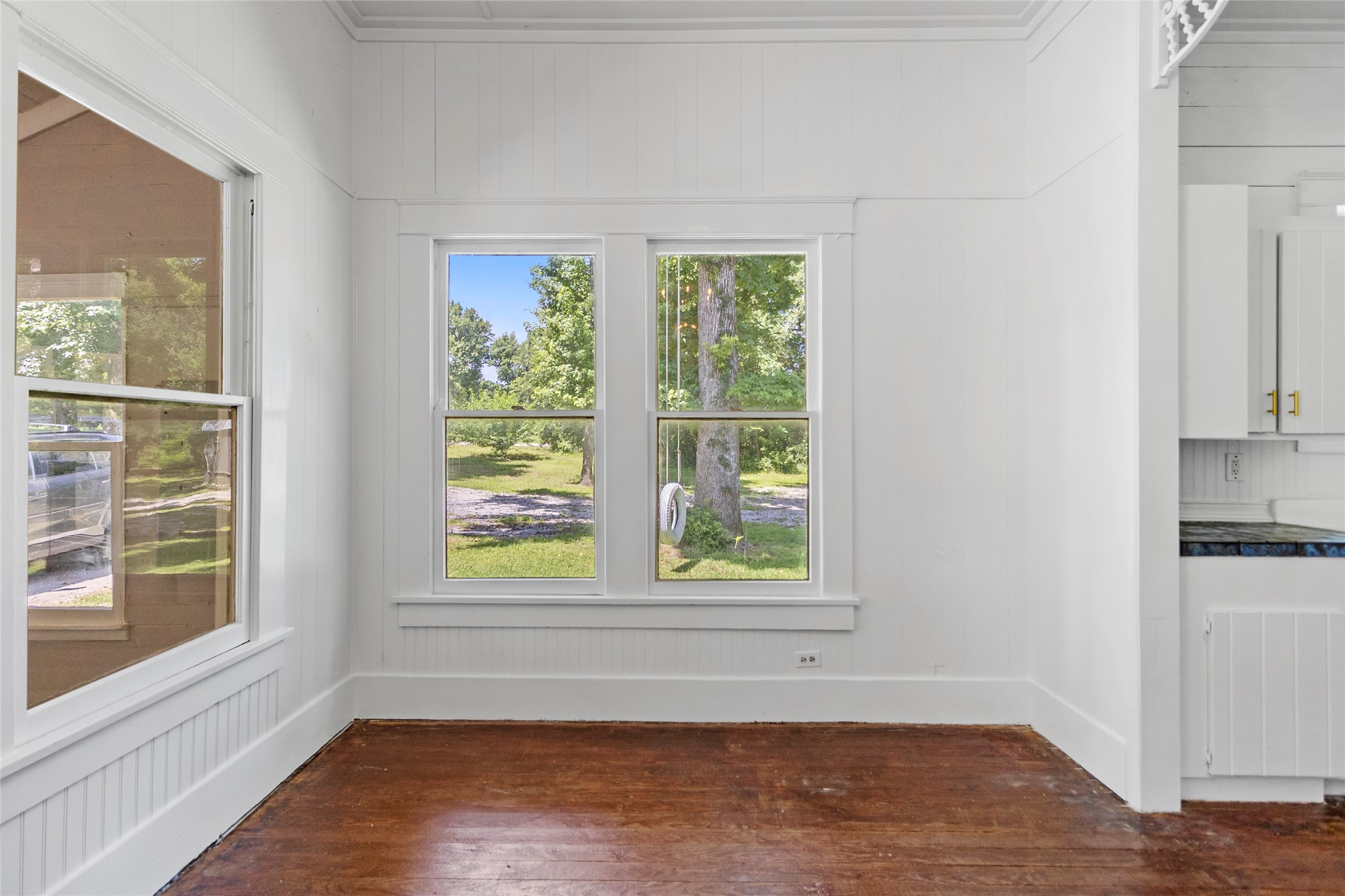 38 Darrell White Road Huntsville, TX 77340 - Photo 12 of 49 an empty room with wooden floor and windows
