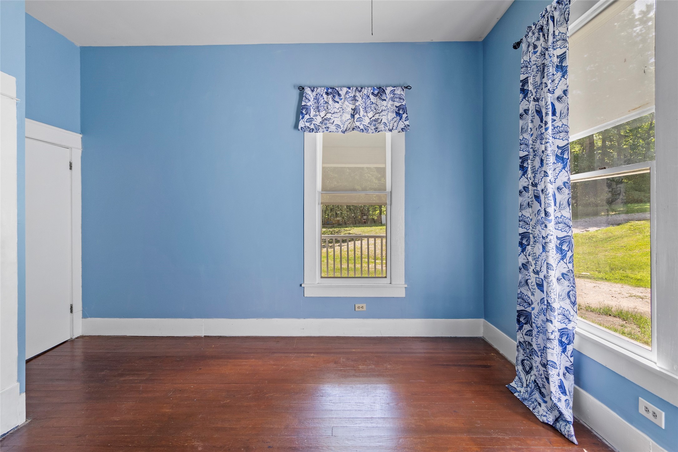 38 Darrell White Road Huntsville, TX 77340 - Photo 18 of 49 a view of an empty room with a window and wooden floor