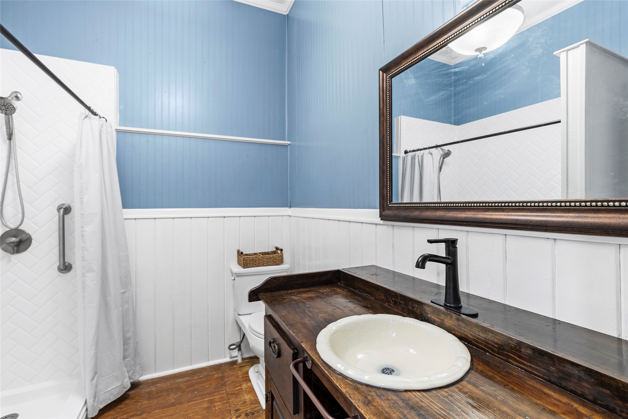 38 Darrell White Road Huntsville, TX 77340 - Photo 20 of 49 a bathroom with a sink a mirror and a toilet