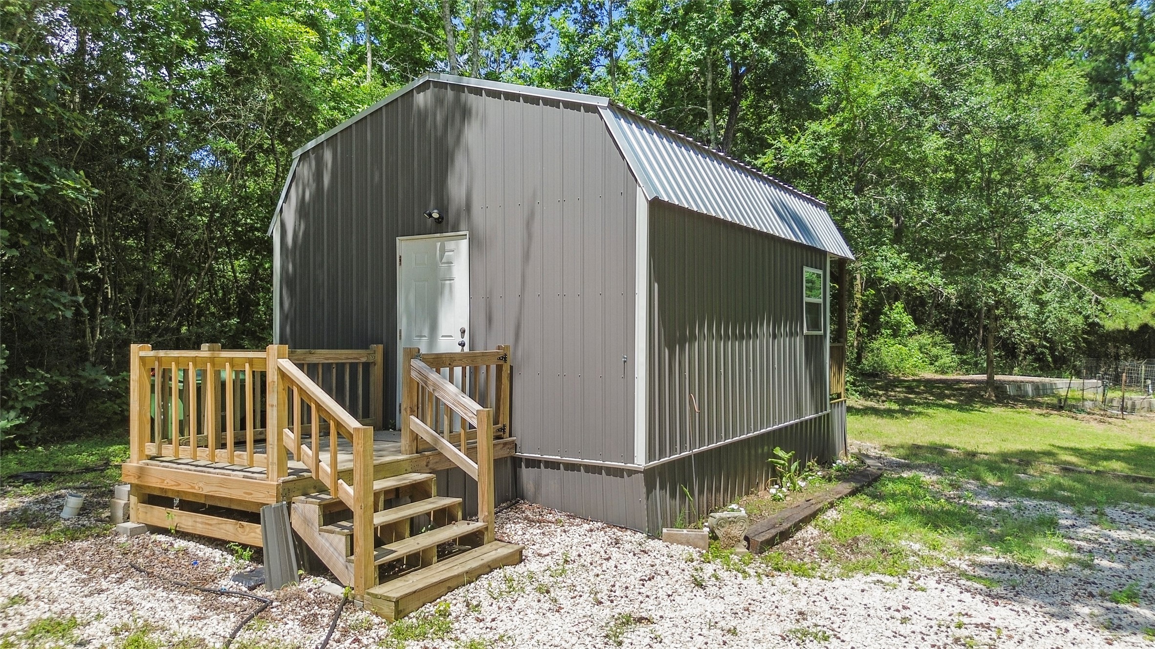 38 Darrell White Road Huntsville, TX 77340 - Photo 37 of 49 a view of backyard with deck and outdoor seating