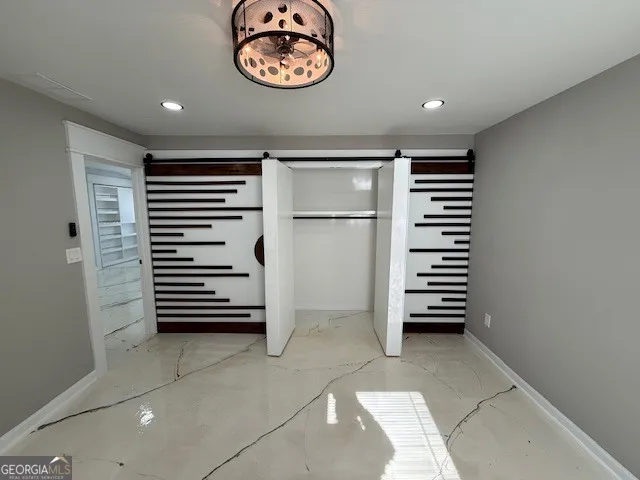 a view of wooden floor and windows in a room