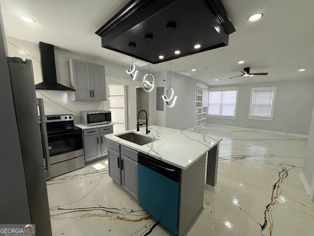 a kitchen with granite countertop a sink and stainless steel appliances