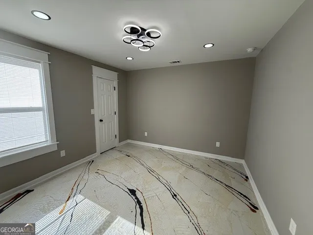 a view of a bedroom with a bed