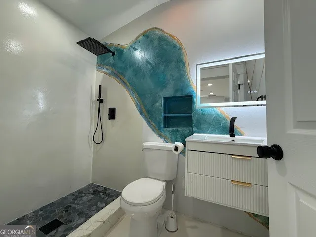 a bathroom with a toilet and a sink