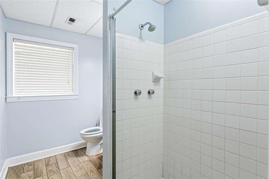 140 Old Fairburn Close Southwest South Fulton, GA 30331 - Photo 20 of 28 a bathroom with a toilet and a shower