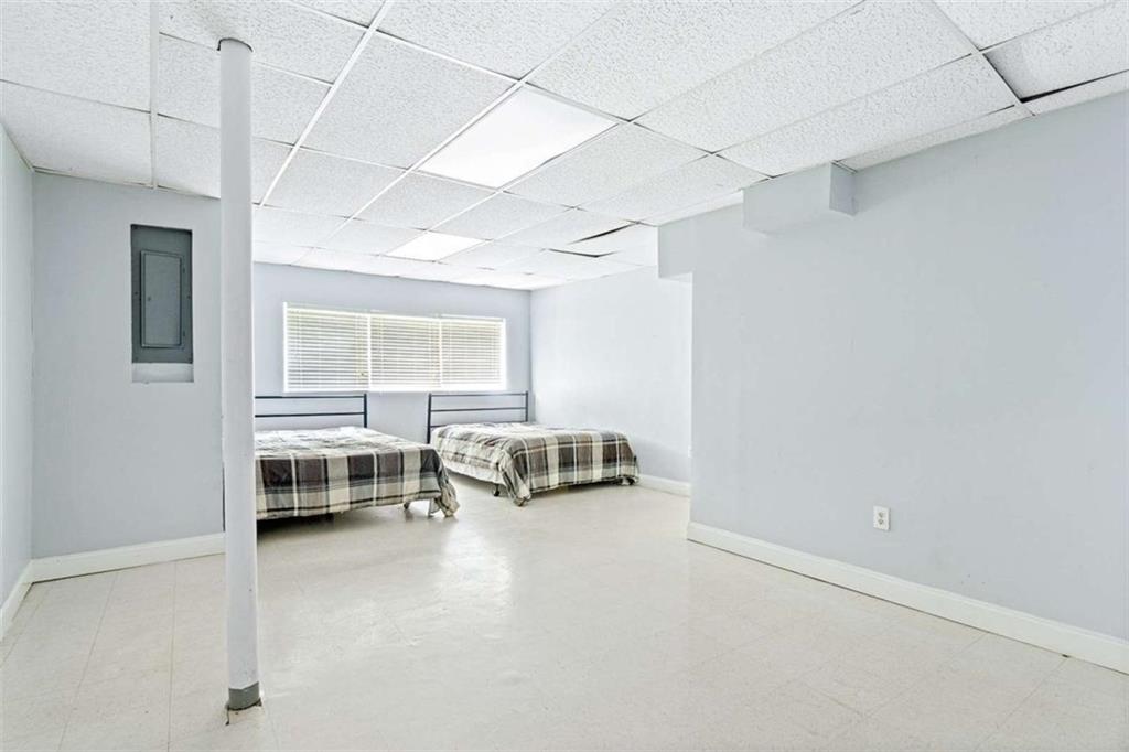 140 Old Fairburn Close Southwest South Fulton, GA 30331 - Photo 21 of 28 a bedroom with furniture and a window