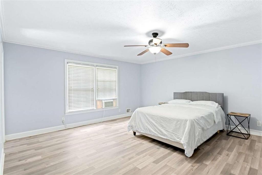 140 Old Fairburn Close Southwest South Fulton, GA 30331 - Photo 22 of 28 a bedroom with a bed and a window