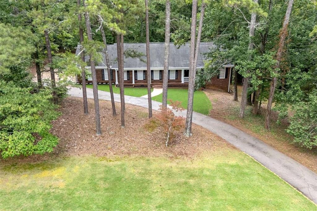 140 Old Fairburn Close Southwest South Fulton, GA 30331 - Photo 27 of 28 a view of a house with a yard