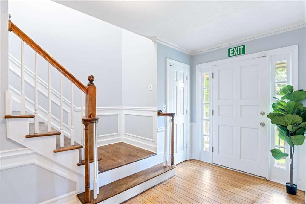 140 Old Fairburn Close Southwest South Fulton, GA 30331 - Photo 3 of 28 a view of entryway with wooden floor and front door