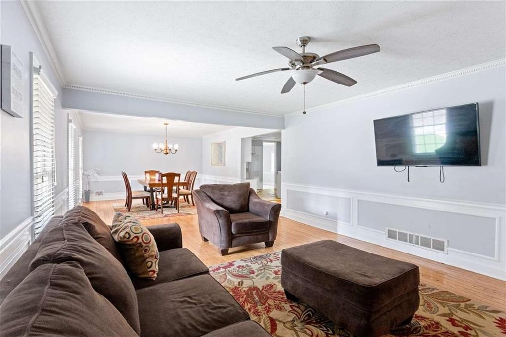 140 Old Fairburn Close Southwest South Fulton, GA 30331 - Photo 4 of 28 a living room with furniture and a flat screen tv