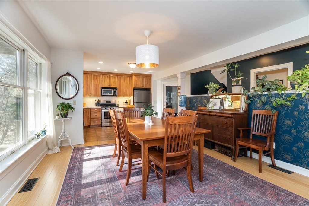 642 North Farms Road Northampton, MA 01062 - Photo 14 of 42 a dining room with furniture a rug and a large window