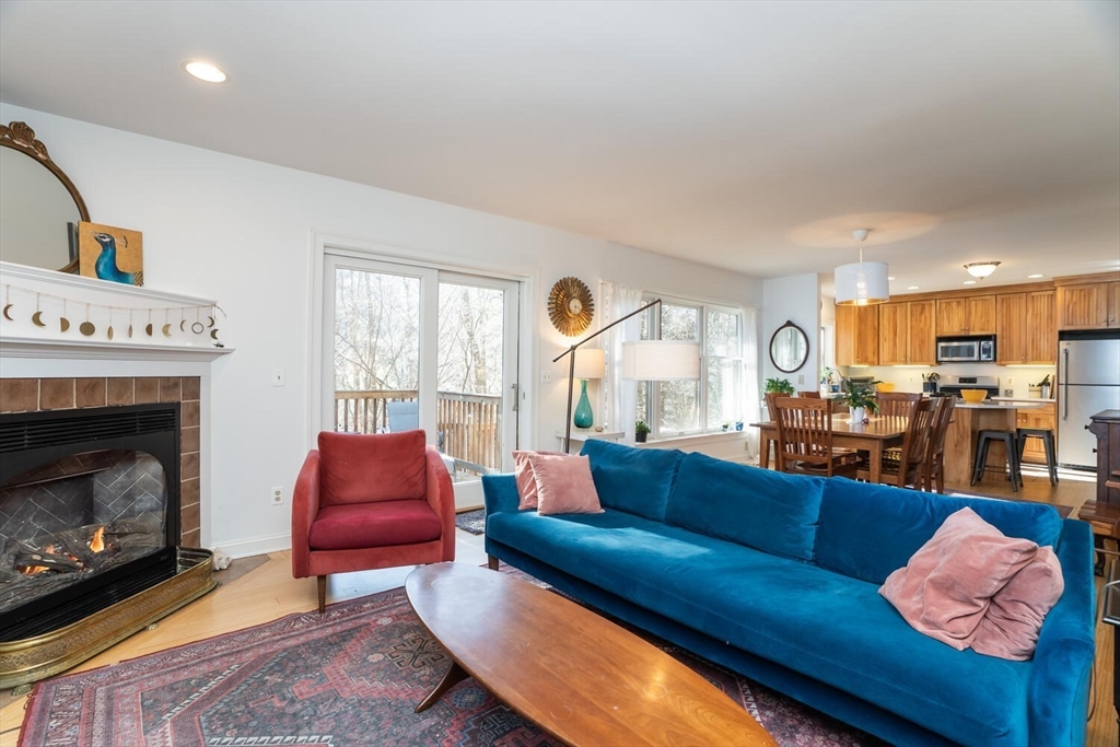 642 North Farms Road Northampton, MA 01062 - Photo 16 of 42 a living room with furniture and a fireplace