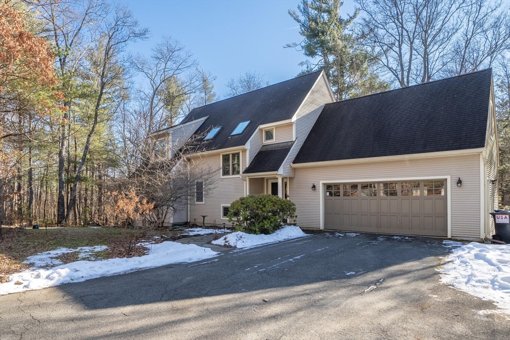 642 North Farms Road Northampton, MA 01062 - Photo 2 of 42 a front view of a house with a yard and garage