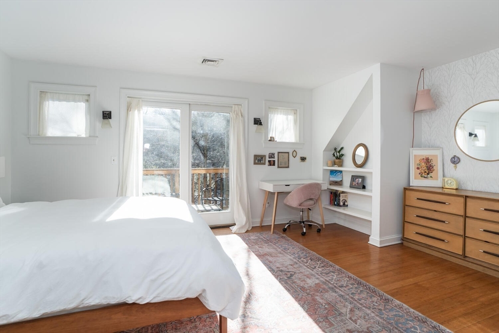 642 North Farms Road Northampton, MA 01062 - Photo 22 of 42 a bedroom with a bed and large windows