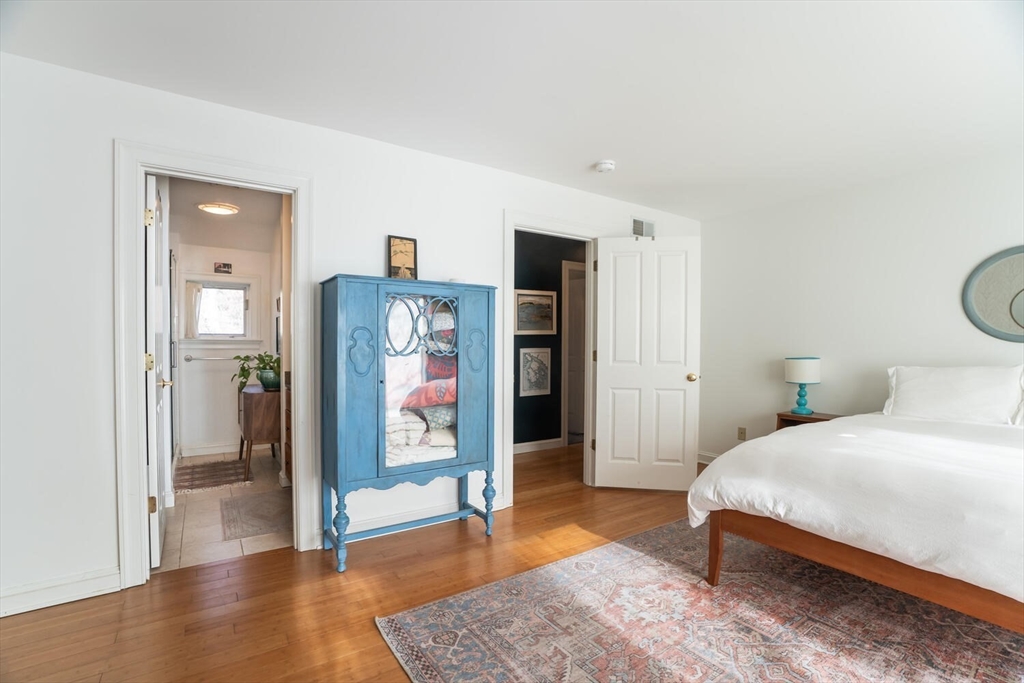 642 North Farms Road Northampton, MA 01062 - Photo 23 of 42 a bedroom with a bed and a table in it