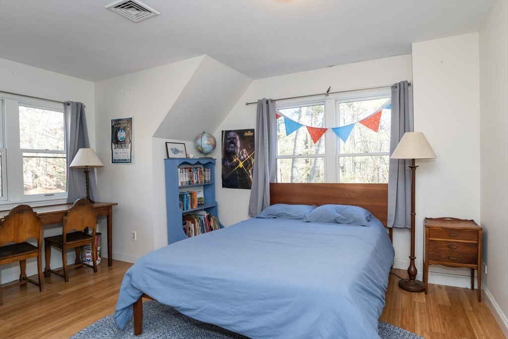 642 North Farms Road Northampton, MA 01062 - Photo 25 of 42 a bedroom with a bed and wooden floor