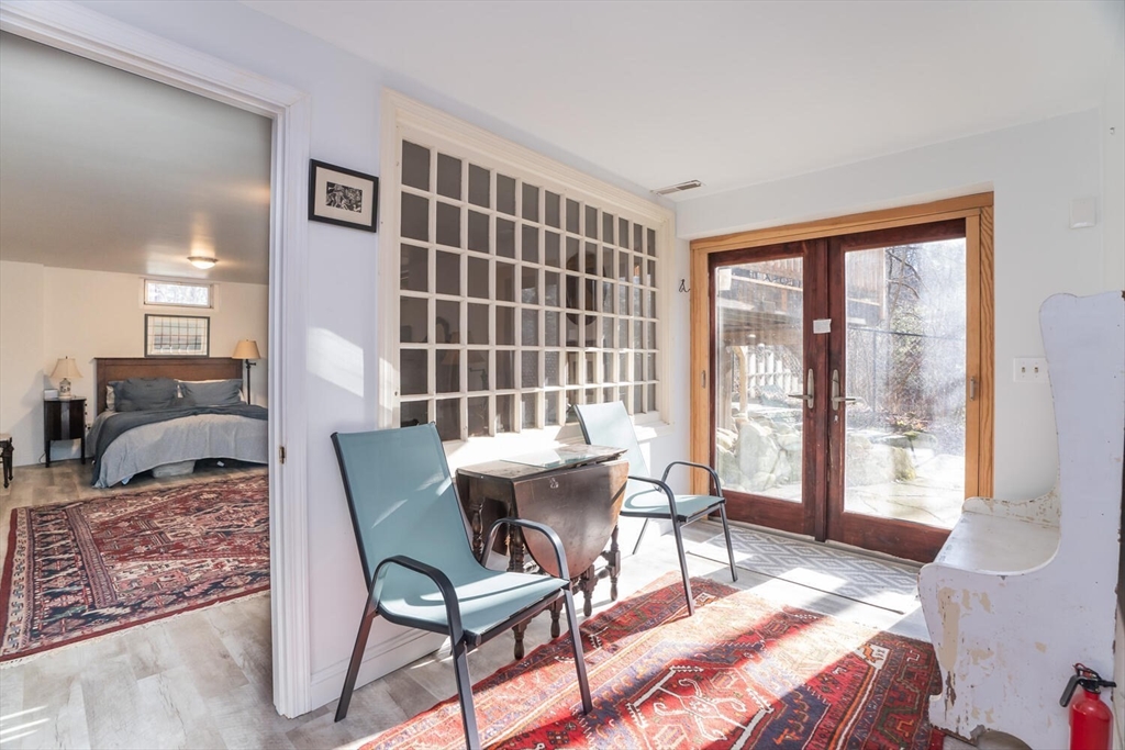 642 North Farms Road Northampton, MA 01062 - Photo 29 of 42 a living room with furniture and a floor to ceiling window
