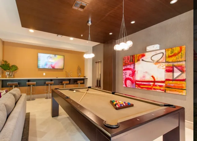 a swimming pool with outdoor seating and yard