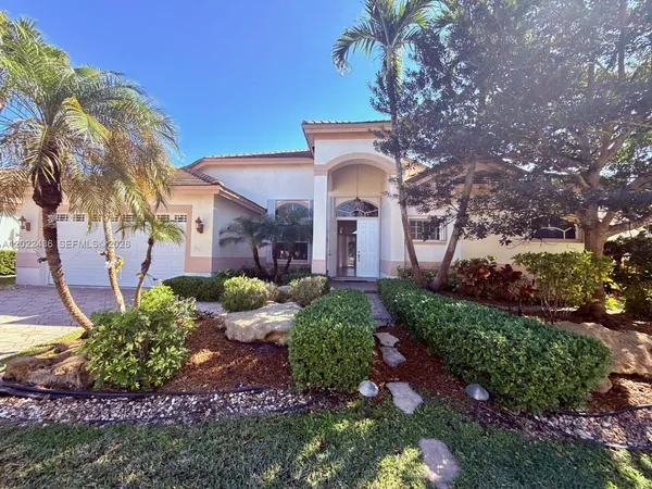 a front view of a house with garden