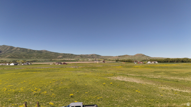 320 South 5400 West Logan, UT 84321 - Photo 14 of 42 Expansive green landscape with distant mountains