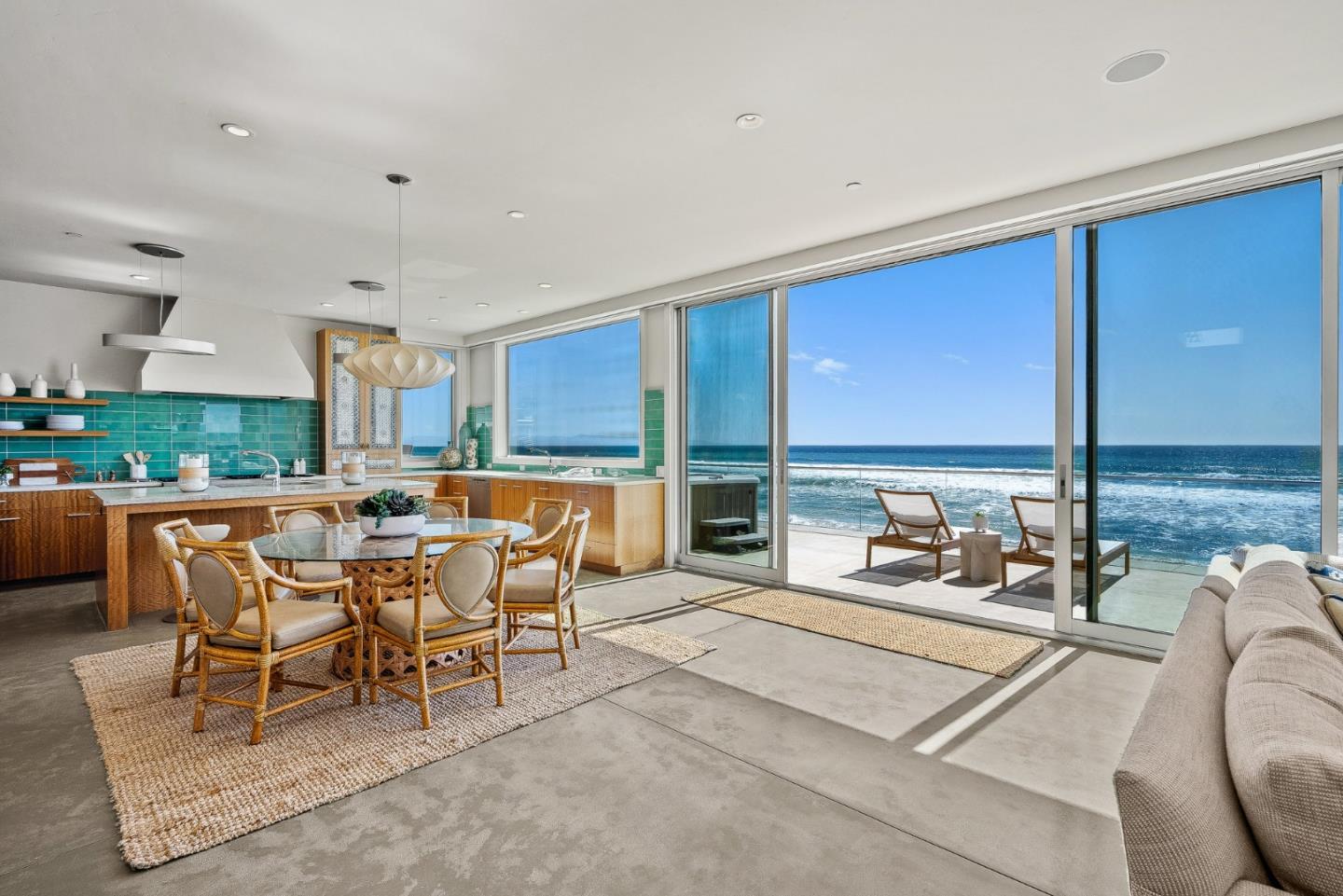 618 Beach Drive Aptos, CA 95003 - Photo 16 of 99 a dining room with furniture a floor to ceiling window and a floor to ceiling window