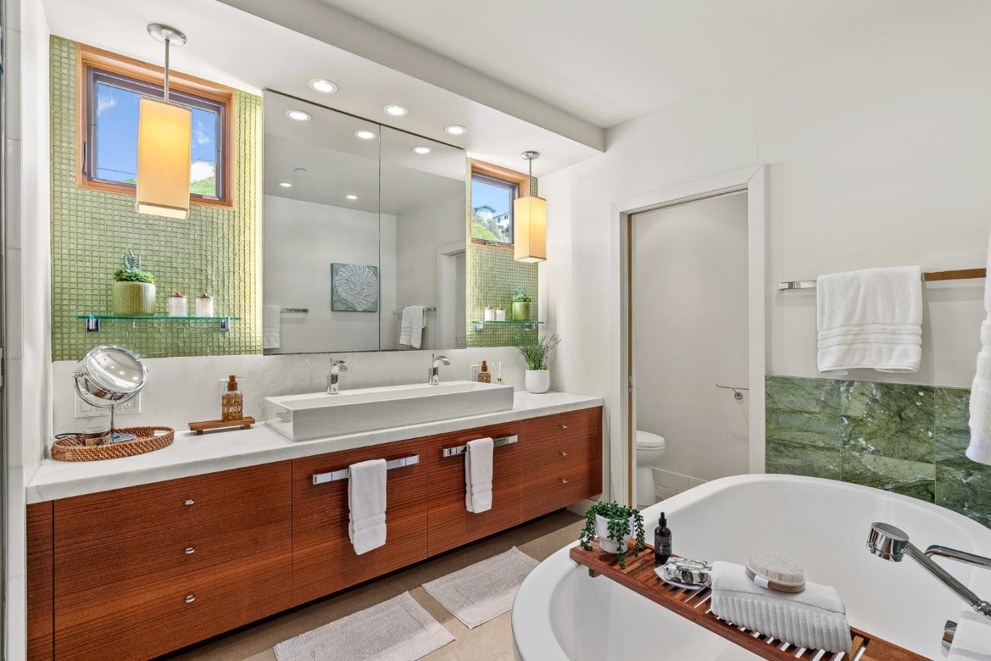 618 Beach Drive Aptos, CA 95003 - Photo 37 of 99 a bathroom with a tub sink and mirror