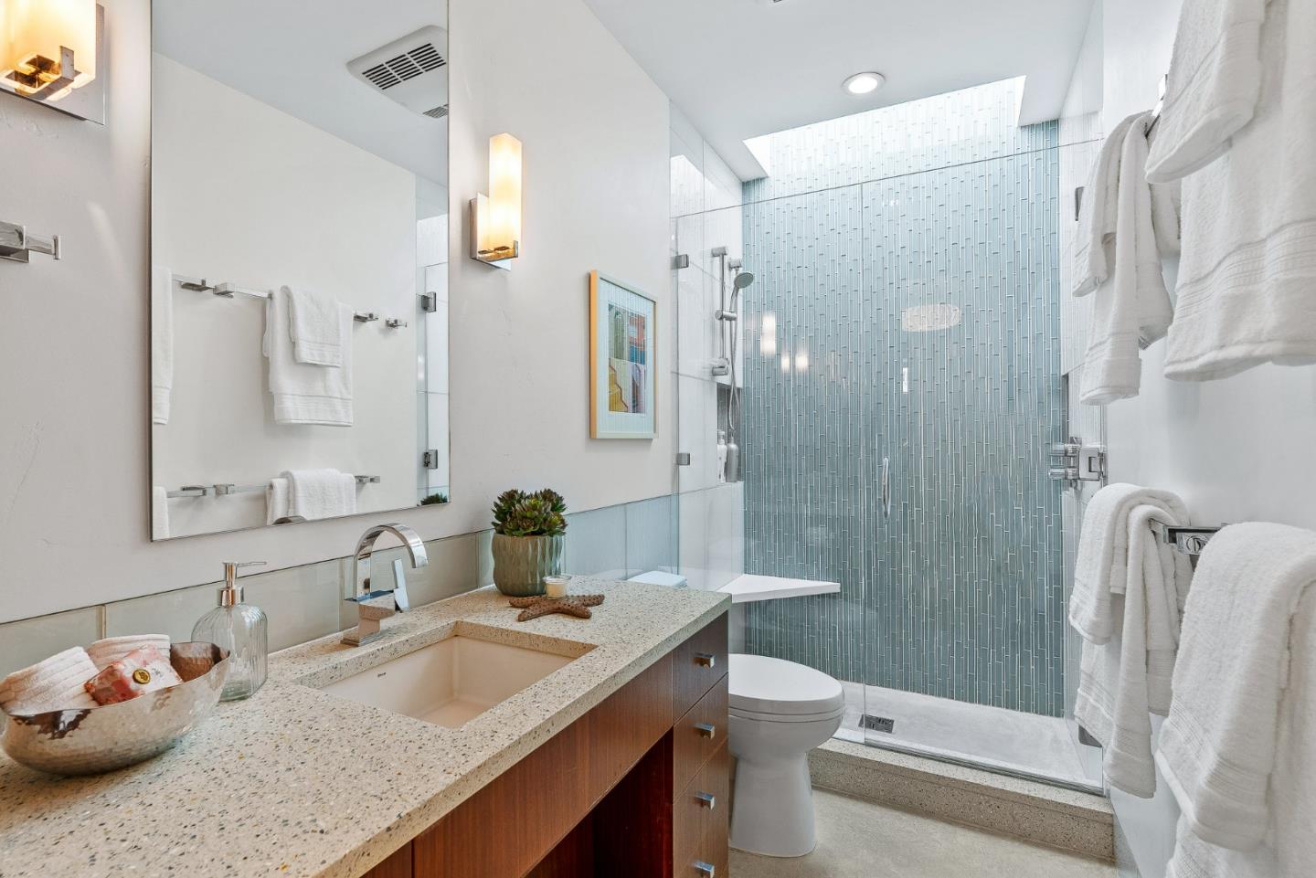 618 Beach Drive Aptos, CA 95003 - Photo 46 of 99 a bathroom with a granite countertop sink toilet and shower