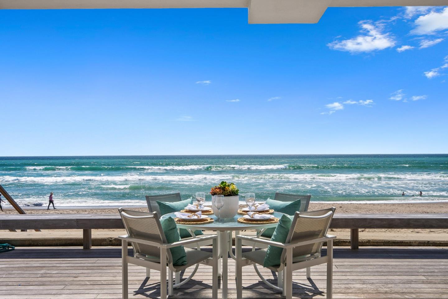 618 Beach Drive Aptos, CA 95003 - Photo 57 of 99 a view of a city from a roof deck with dining table and chairs