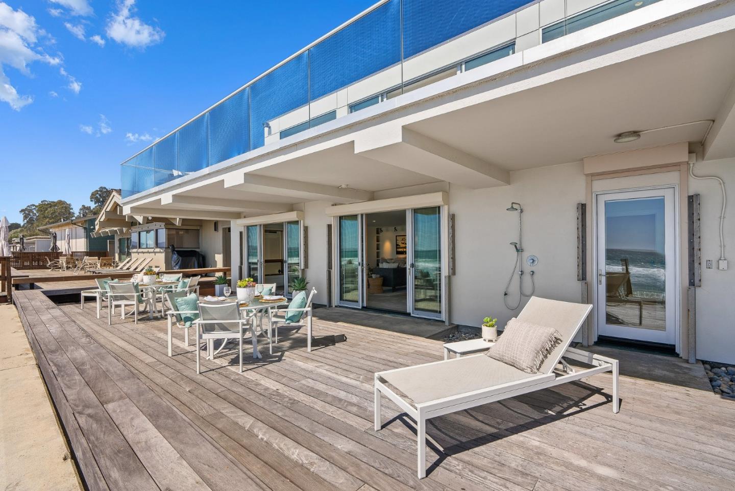 618 Beach Drive Aptos, CA 95003 - Photo 60 of 99 a view of a patio with couches table and chairs and potted plants