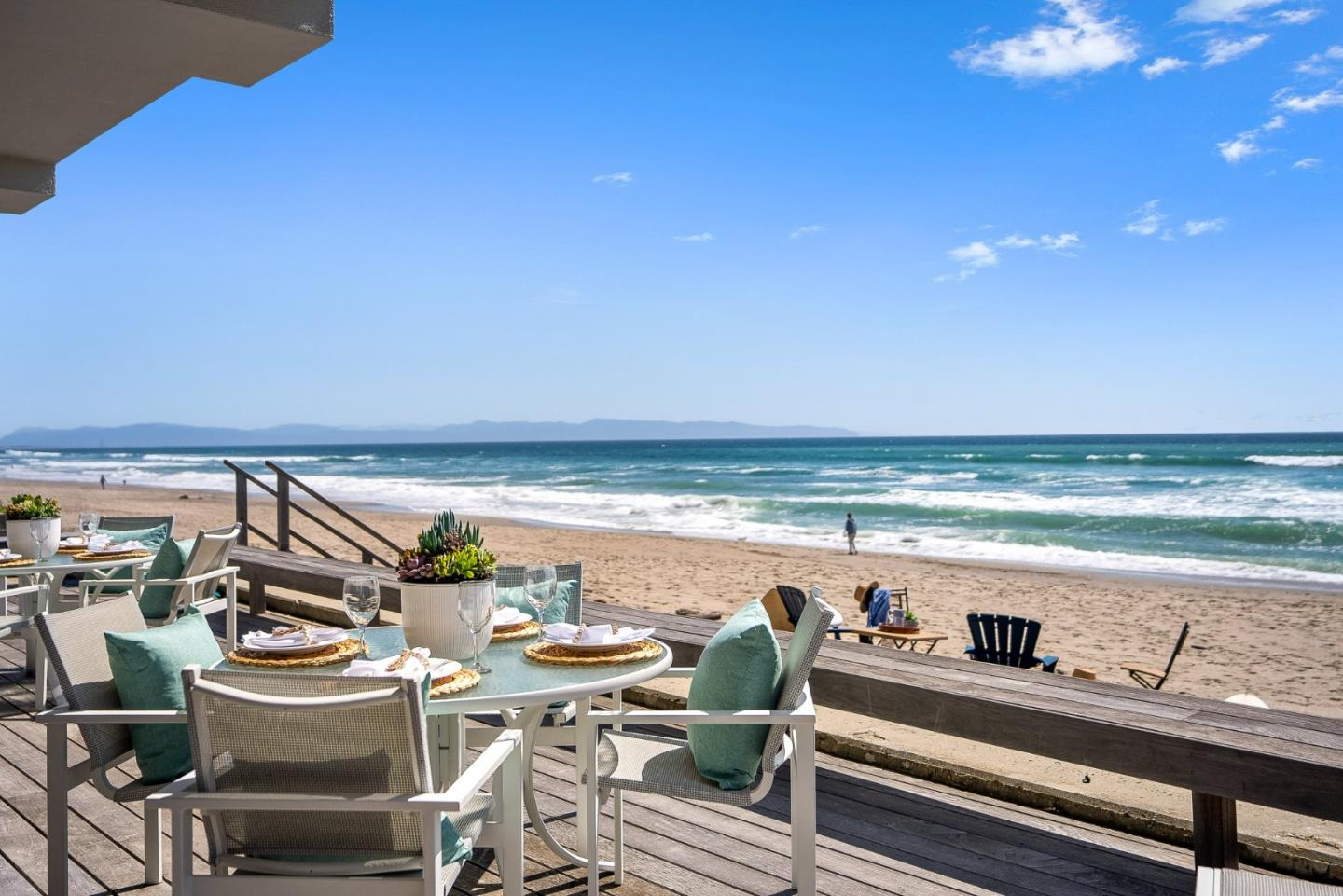 618 Beach Drive Aptos, CA 95003 - Photo 70 of 99 a view of a balcony with dining table and chairs with wooden floor