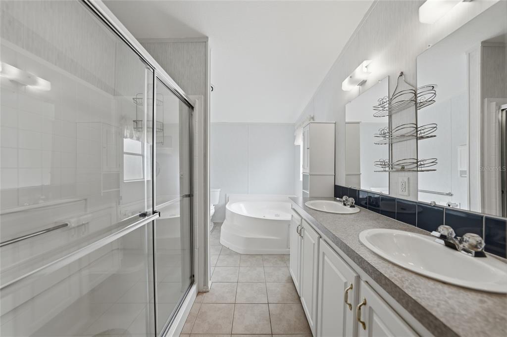 11923 Southwest Loop Terrace Arcadia, FL 34269 - Photo 21 of 50 a bathroom with a sink a toilet and shower