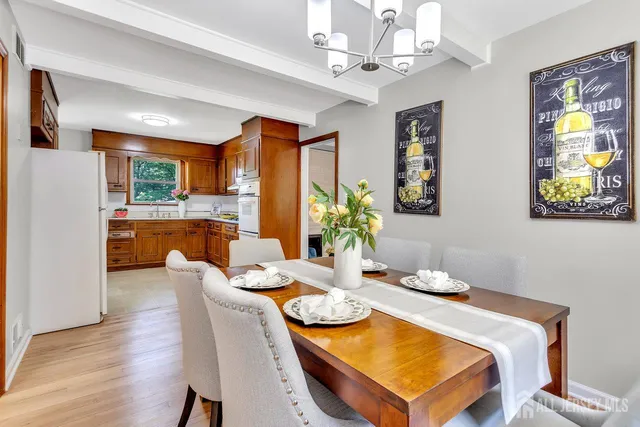 a dining room with furniture and window